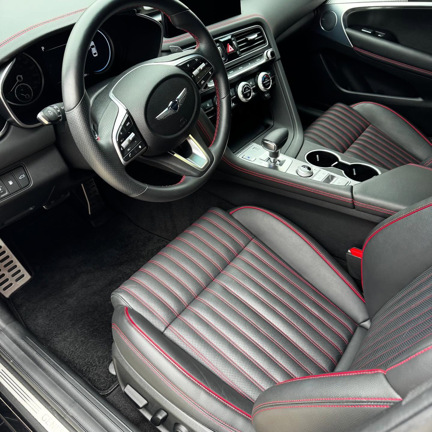 Genesis black and red leather seat after interior car detailing