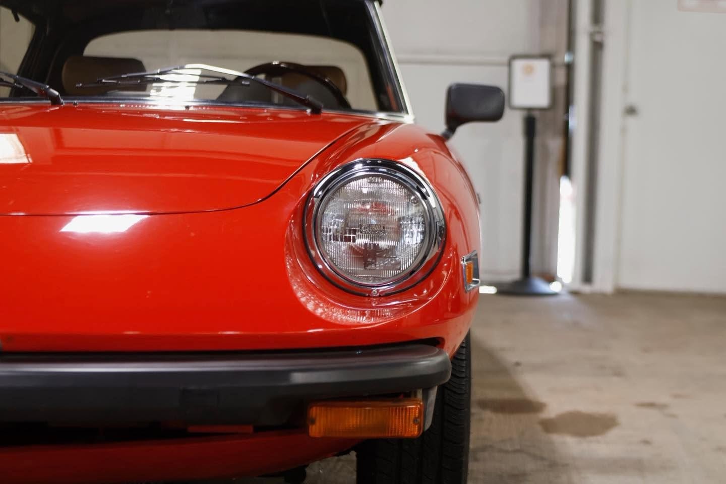 Alfa Romeo headlight close-up after exterior detailing